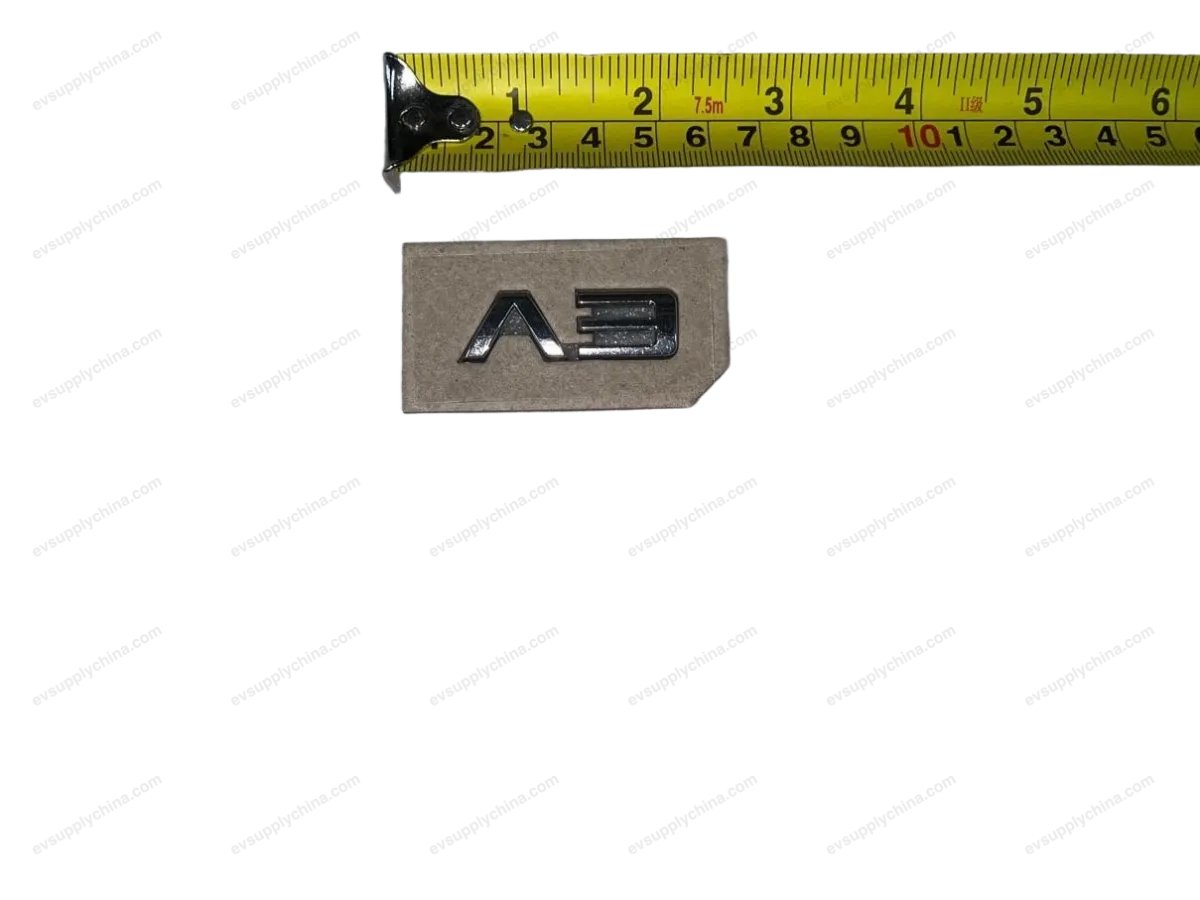 EV logo assembly — BYD BYD Atto 3 — OE 12957133-00, STEB-3921700